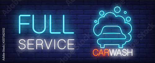 Full service car wash neon sign. Vehicle in foam and luminous inscription on brick wall. Vector illustration in neon style for cleaning company