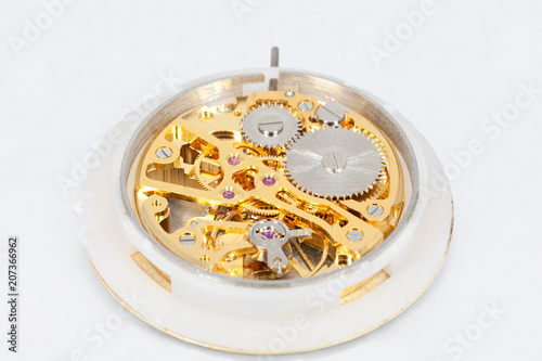 Clockwork mechanism of a pocket watch in gold, with jewels, close-up