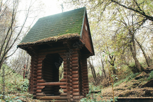 Wooden chapel near the Holy spring in the forest