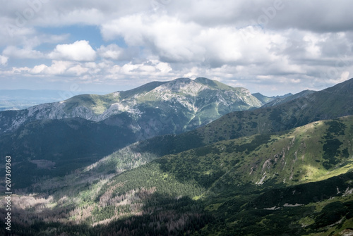 hige rocky Kominiarski Wierch peak with other peaks around in Western Tatras mountains in Poland photo