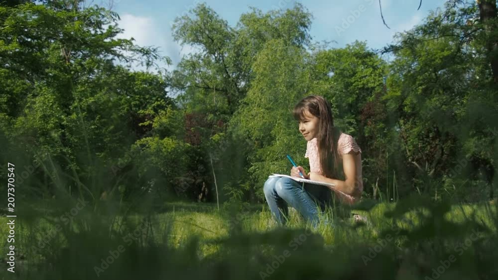 Little artist. The child draws in the park. Little artist. The child draws in the park.