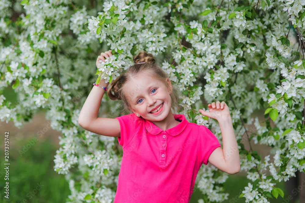 Outdoor Portrait of Little Girl Amidst Spring Flowers Outdoor Portrait of Little Girl Amidst Spring Flowers