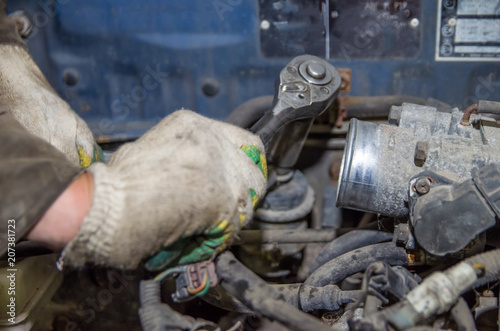 a man is repairing a car