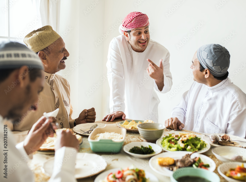 Muslim men celebrating ending of Ramadan Muslim men celebrating ending of Ramadan
