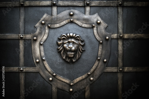 decorative processing of a metal fence in the form of a lion on a shield