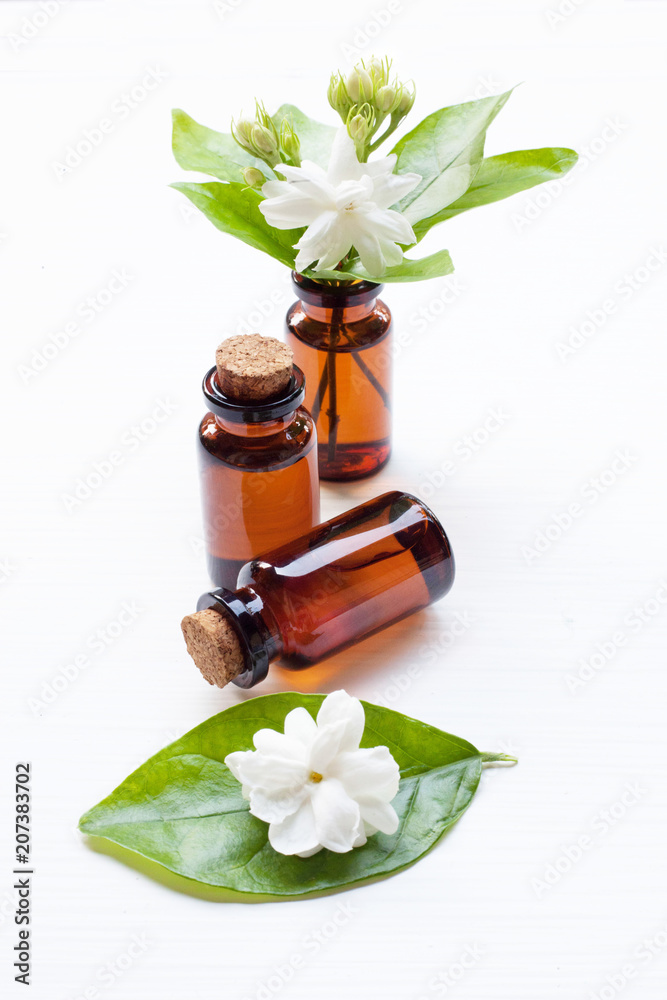 Essential oil with jasmine flower on white background. Essential oil with jasmine flower on white background.