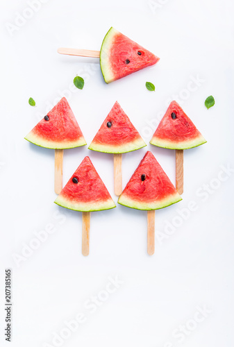 Fresh and sweet watermelon slice popsicles on white background