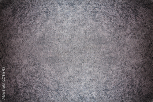 Grey textured concrete wall. Dark edges