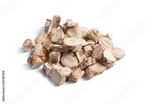 Dried medicinal herbs raw materials isolated on white. Root of Acorus calamus