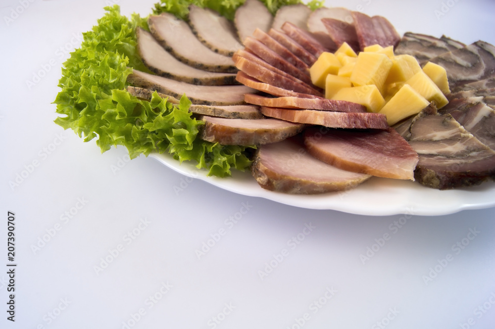 Sausage with baked meat and meat roll on a light background Sausage with baked meat and meat roll on a light background