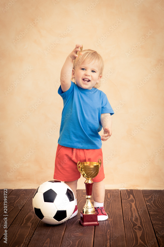 Child is pretending to be a soccer player Child is pretending to be a soccer player