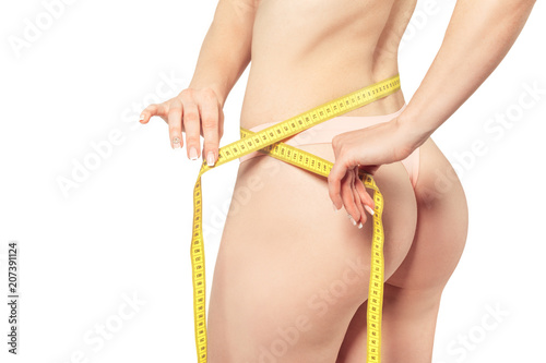 Healthy female body with measuring tape