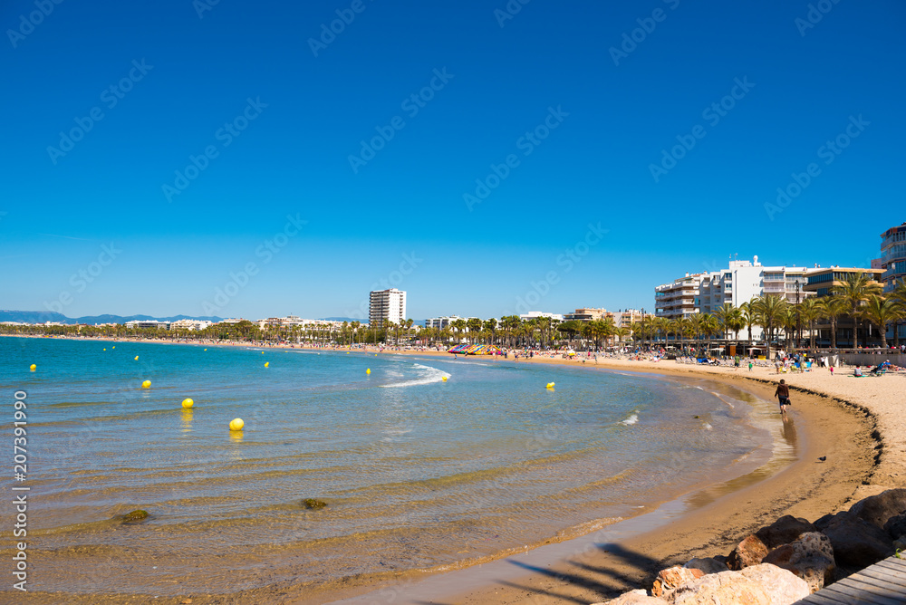 SALOU, TARRAGONA, SPAIN - APRIL 24, 2017: Coastline Costa Dorada, main beach in Salou. Blue sky. Copy space for text.