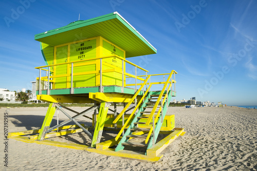 Scenic morning view of an iconic lifeguard tower in bright pastel colors on South Beach, Miami © lazyllama