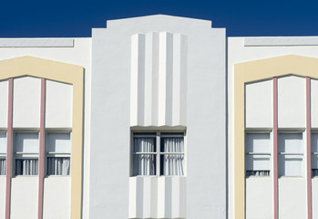Typical pastel-colorfed 1930s Art Deco architecture with palm trees in Miami, Florida
