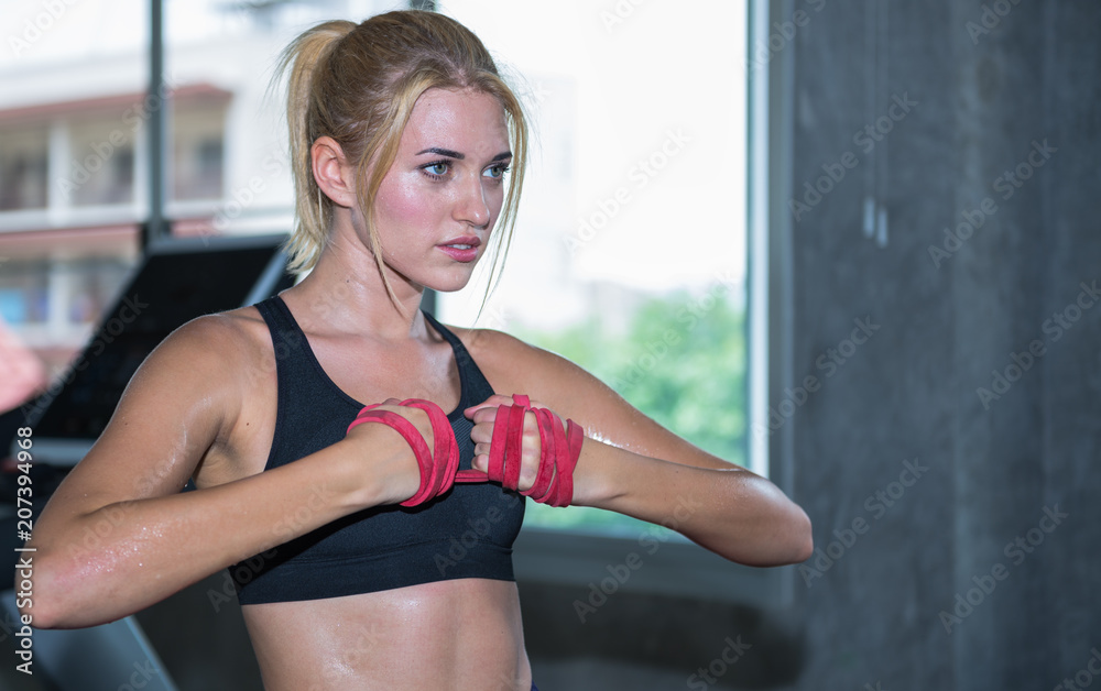 A beautiful woman training with resistance band