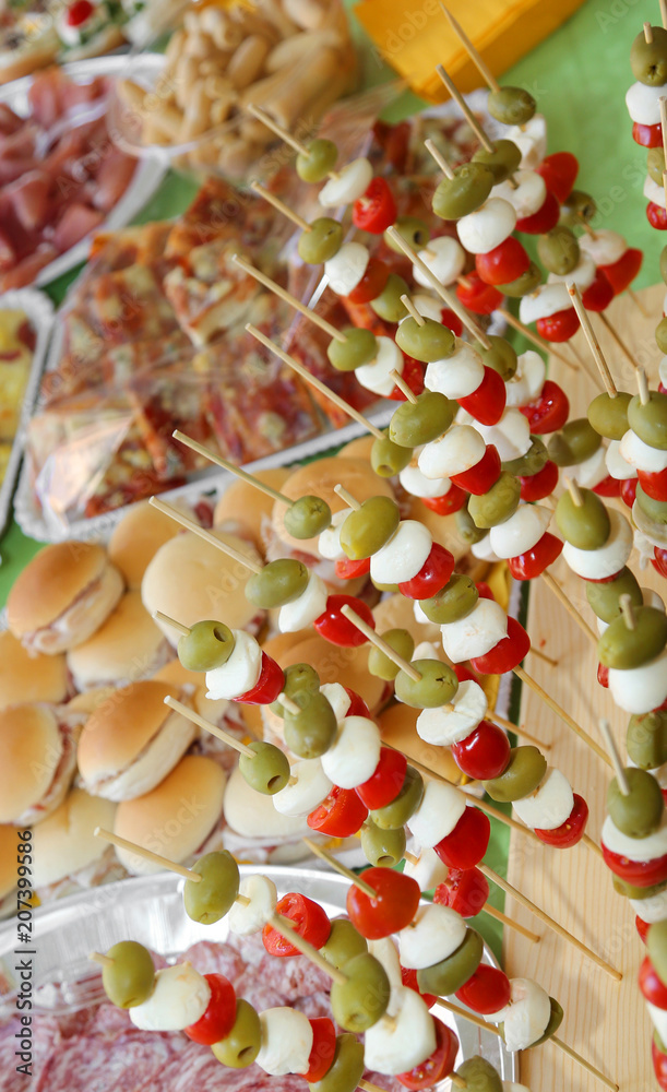 Fototapeta premium skewers with olives, mozzarella cheese of bufala, mortadella and