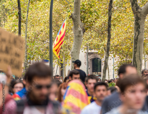 BARCELONA, SPAIN - OCTOBER 3, 2017: Demonstrators bearing catalan flag during protests for independence in Barcelona, Barcelona.
