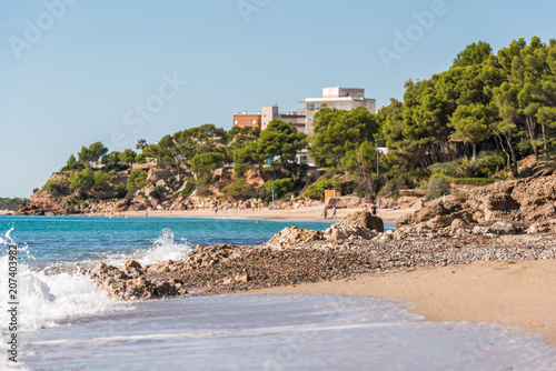 Fototapeta Naklejka Na Ścianę i Meble -  MIAMI PLATJA, SPAIN - SEPTEMBER 18, 2017: View of the sandy beach. Copy space for text.