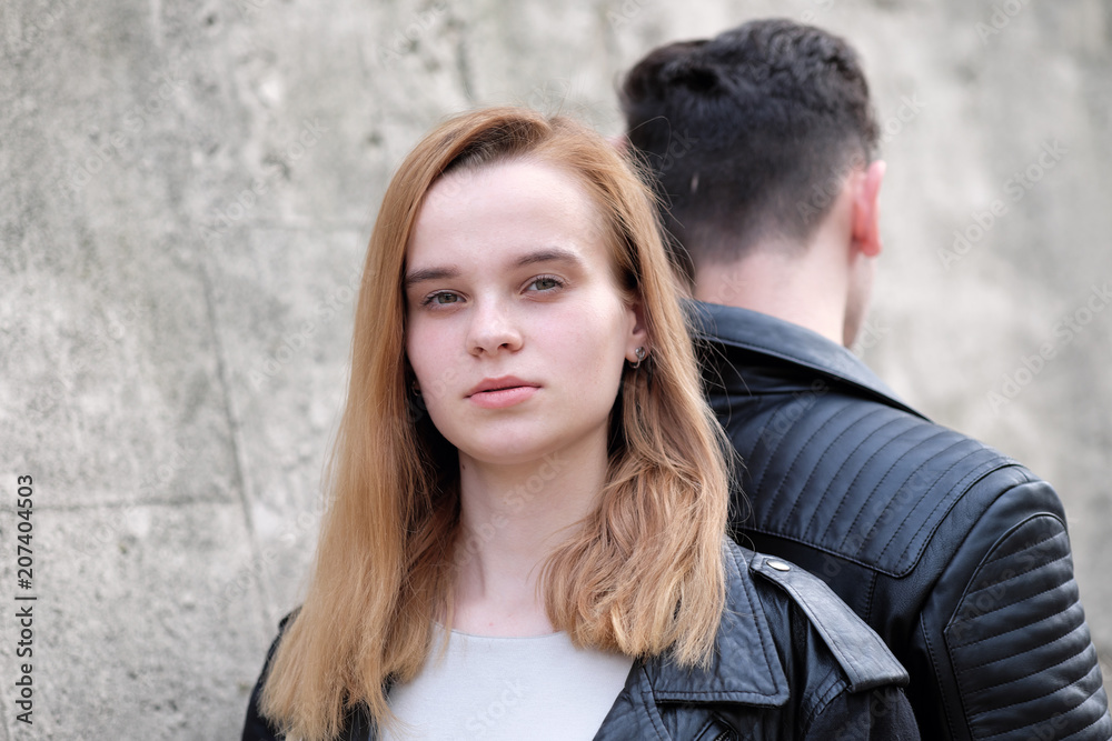 beautiful red haired girl and the guy turned away from her