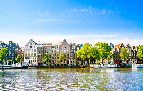 Amsterdam, The Netherlands May 27 2018 - Old houses on the River Amstel in Amsterdam photo