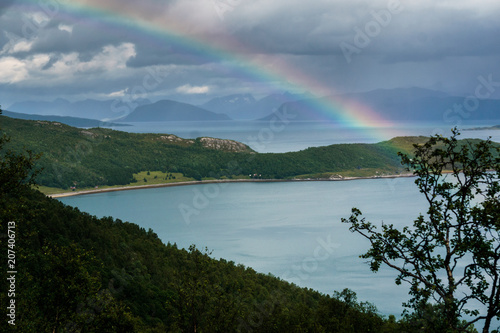 Rainbow. Rainbow over a fjord in Norway. Norwegian. Rain.