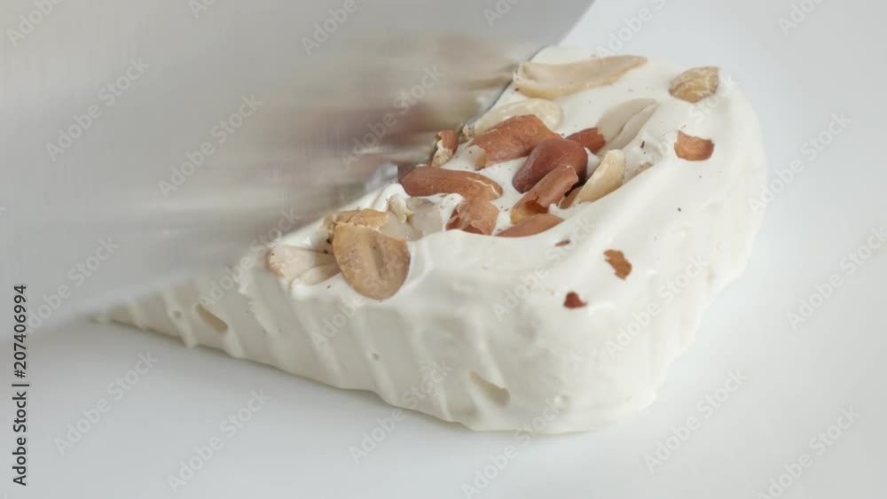 Close-up cutting nougat halva with knife video Close-up cutting nougat halva with knife video