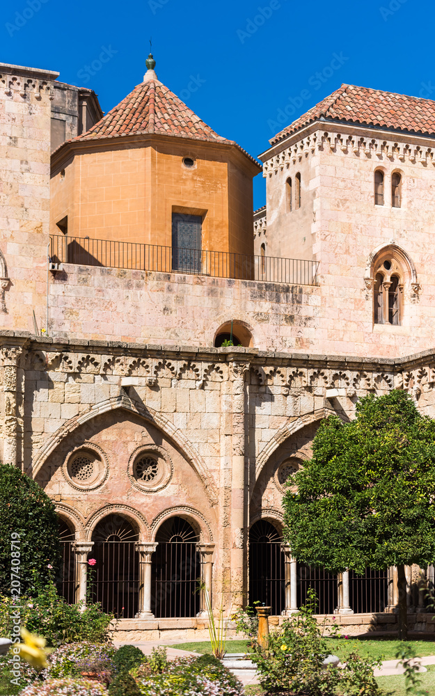 TARRAGONA, SPAIN - OCTOBER 4, 2017: View of the courtyard of the Tarragona Cathedral (Catholic cathedral) on a sunny day. Copy space for text. Vertical.