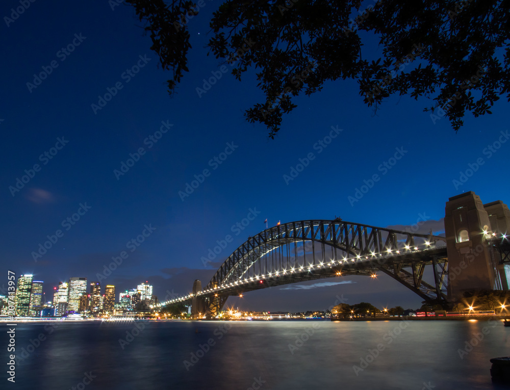 Sydney Harbour Bridge and Skyline. Illuminated by the Vivid Festival lights. 2018.
