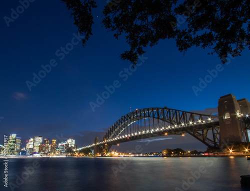 Sydney Harbour Bridge and Skyline. Illuminated by the Vivid Festival lights. 2018.