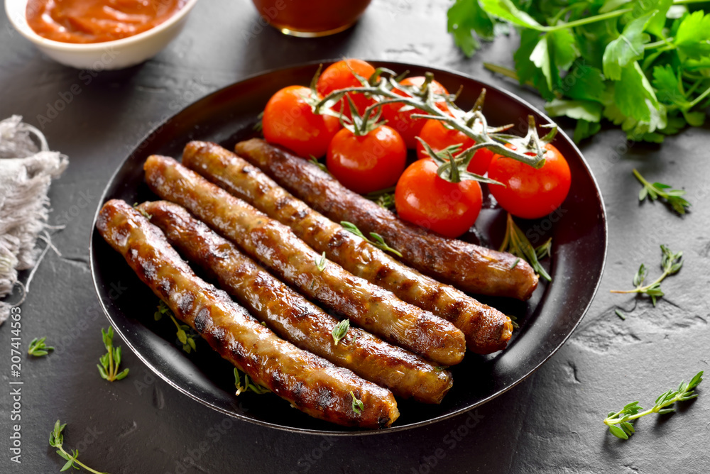Roasted sausages and cherry tomatoes Roasted sausages and cherry tomatoes