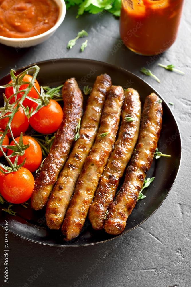 Fried sausage and cherry tomatoes