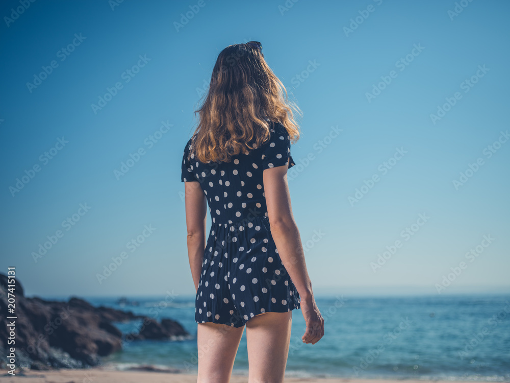 Beautiful young woman  on the beach