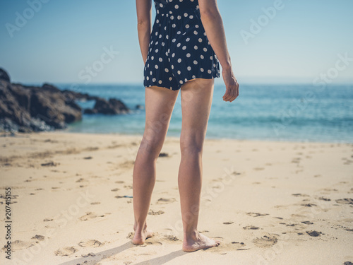 Beautiful young woman  on the beach © LoloStock