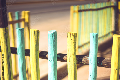 Bright stakes of wooden fence