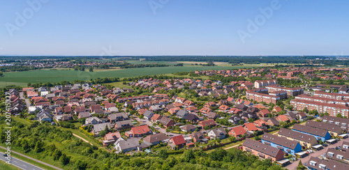 Aerial view of a suburb on the outskirts of Wolfsburg in Germany, with terraced houses, semi-detached houses and detached houses © Frank