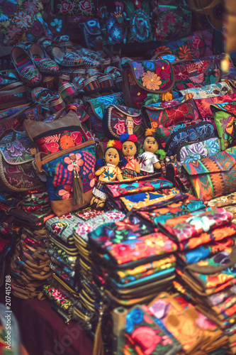 Colorful bags on market stall photo