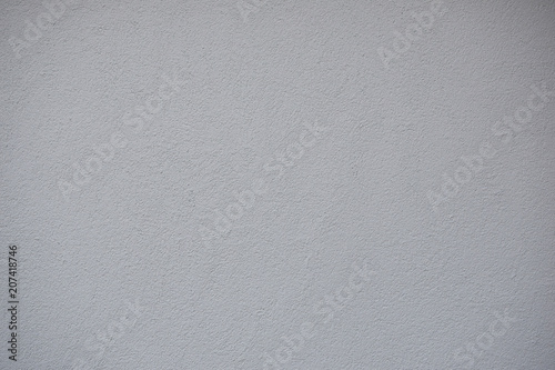 Very light grey just painted clean grunge plaster wall as abstract textured background.