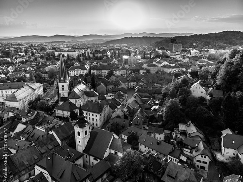 Aerial view of Ljubljana, capital of Slovenia. Roooftops of Ljubljanas old medieval city center seen from Ljubljanas castle at sunset. Black and white image. photo
