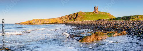 Panorama of Dunstanburgh Castle / Located between Craster and Embleton in Northumberland on the North East Coast photo
