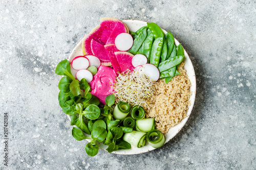 Vegan, detox Buddha bowl recipe with quinoa, snow peas, cucumber, watermelon radish, beet hummus, alfalfa seed sprouts