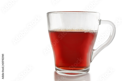 Glass cup of tea on a white background.