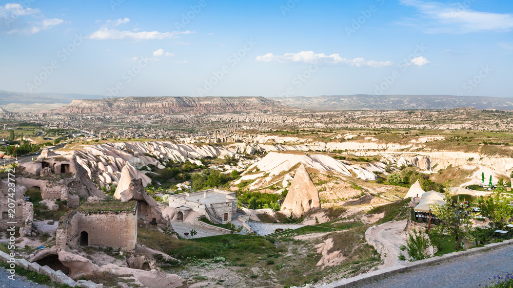 rock-cut buildings in Uchisar town in Cappadocia