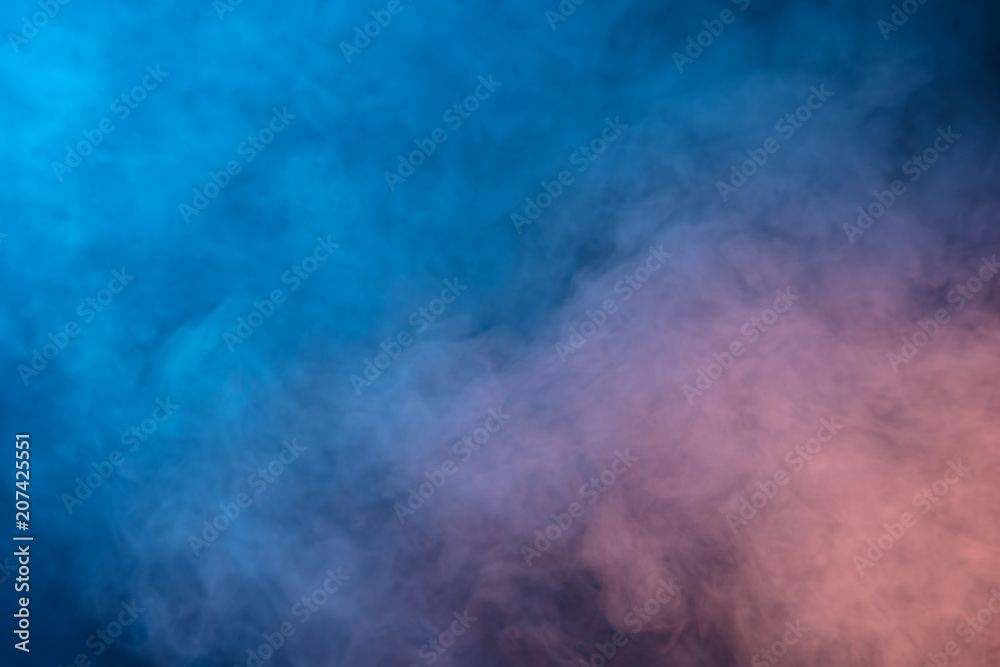Abstract blue and pink smoke on a dark background