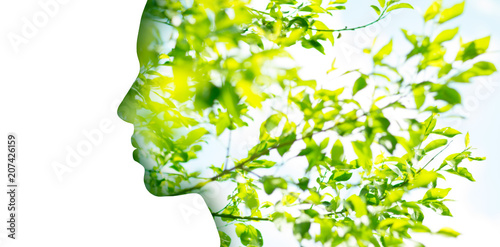 beauty, nature and ecology concept - portrait of woman profile with green tree foliage with double exposure effect