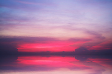 Papier peint photo Pourpre reflection of sunset heap cloud on sea water surface  © darkfoxelixir