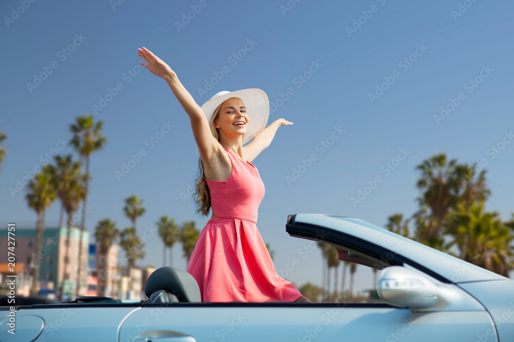 © Syda Productions - travel, summer holidays, road trip and people concept - happy young woman wearing hat in convertible car enjoying sun over venice beach background in california © Syda Productions - travel, summer holidays, road trip and people concept - happy young woman wearing hat in convertible car enjoying sun over venice beach background in california