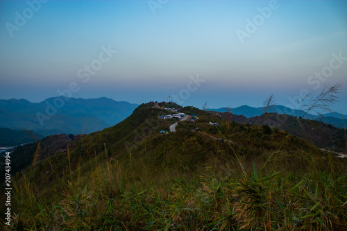 Light sunset behind the mountains Nern Chang Suek  hills, Kanchanaburi, Thailand photo