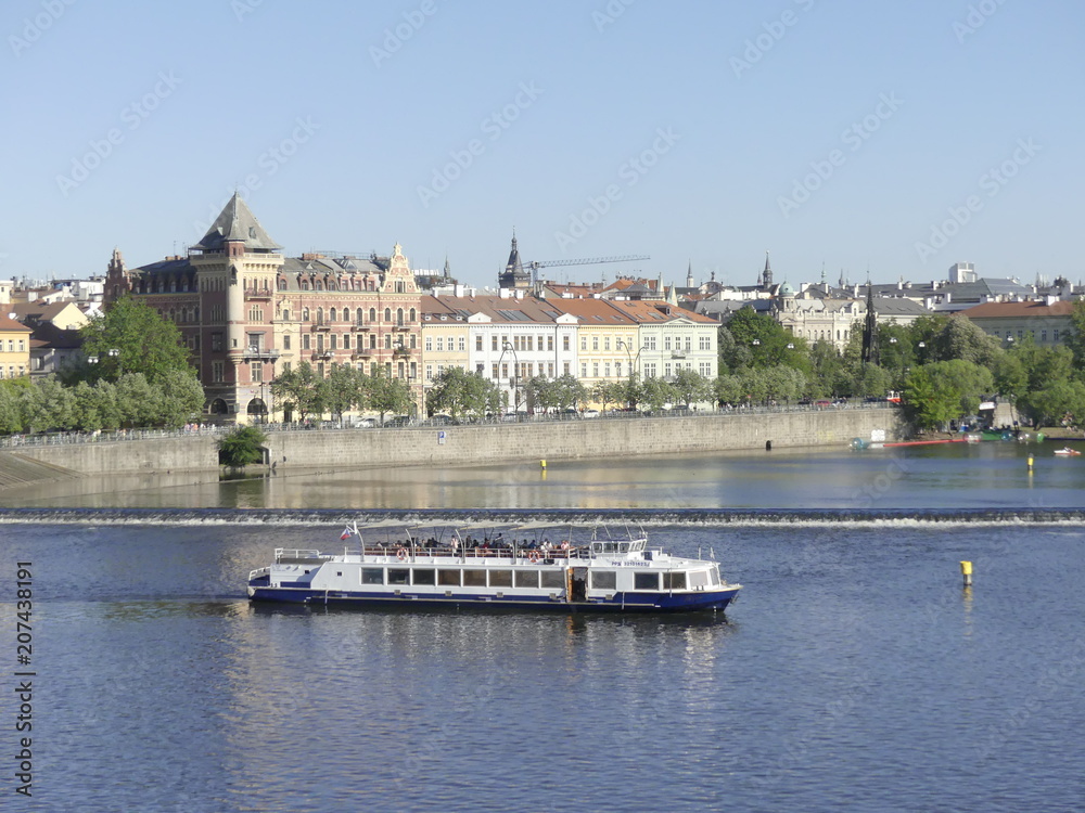 View of the Vltava River. Bridge over the Vltava River. The ship sails by Vltava River.