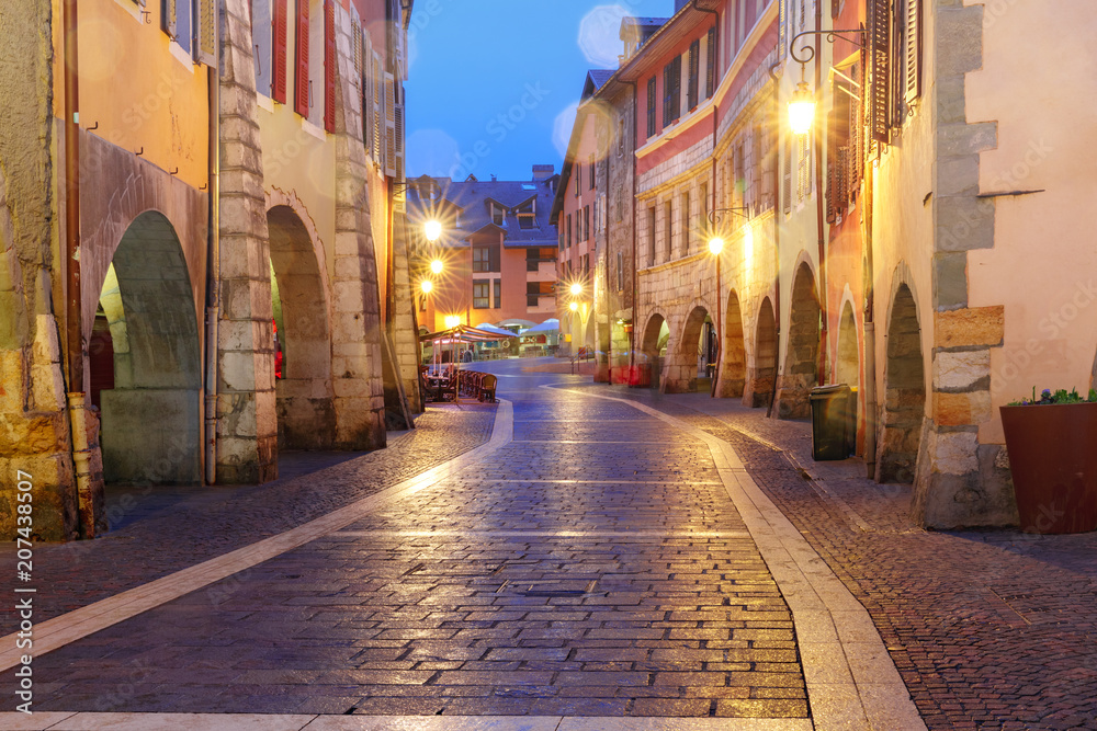 Nice street Rue Sainte-Claire in Old Town of Annecy at rainy night, France